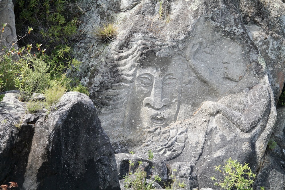 a rock with a carving of a person on it