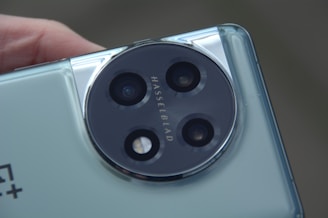 a close up of a person holding a cell phone