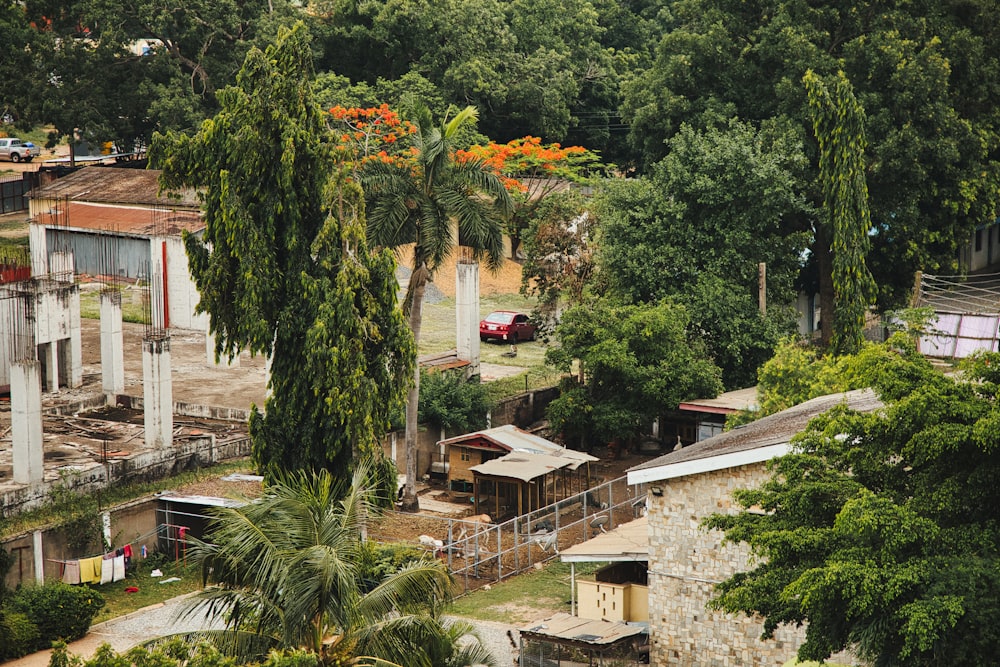 an aerial view of a small village with trees