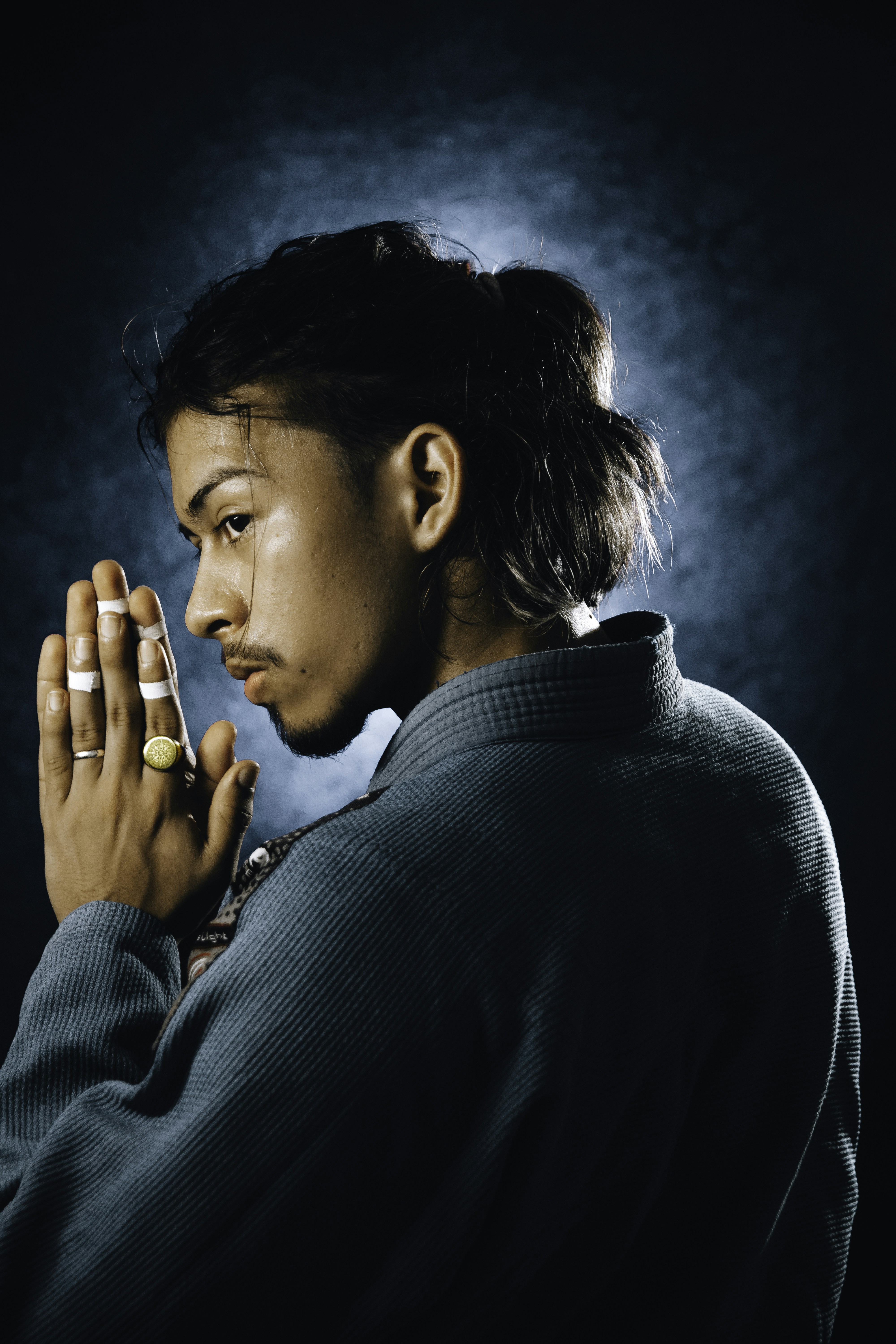 a man with his hands folded in prayer