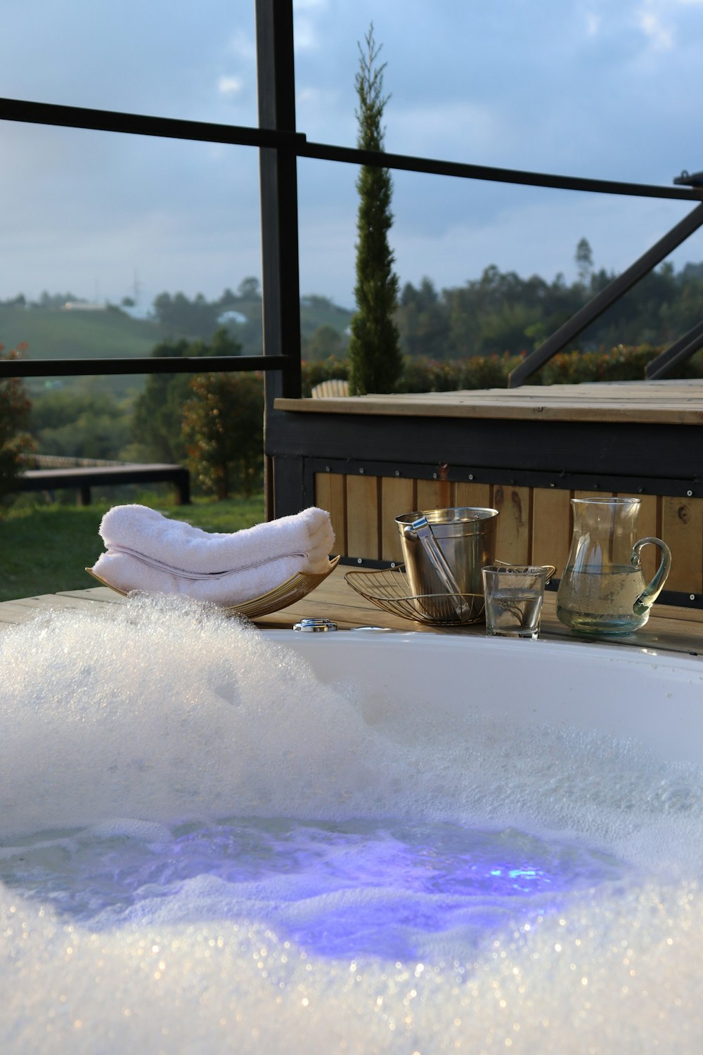 a hot tub with a blue light in the middle of it