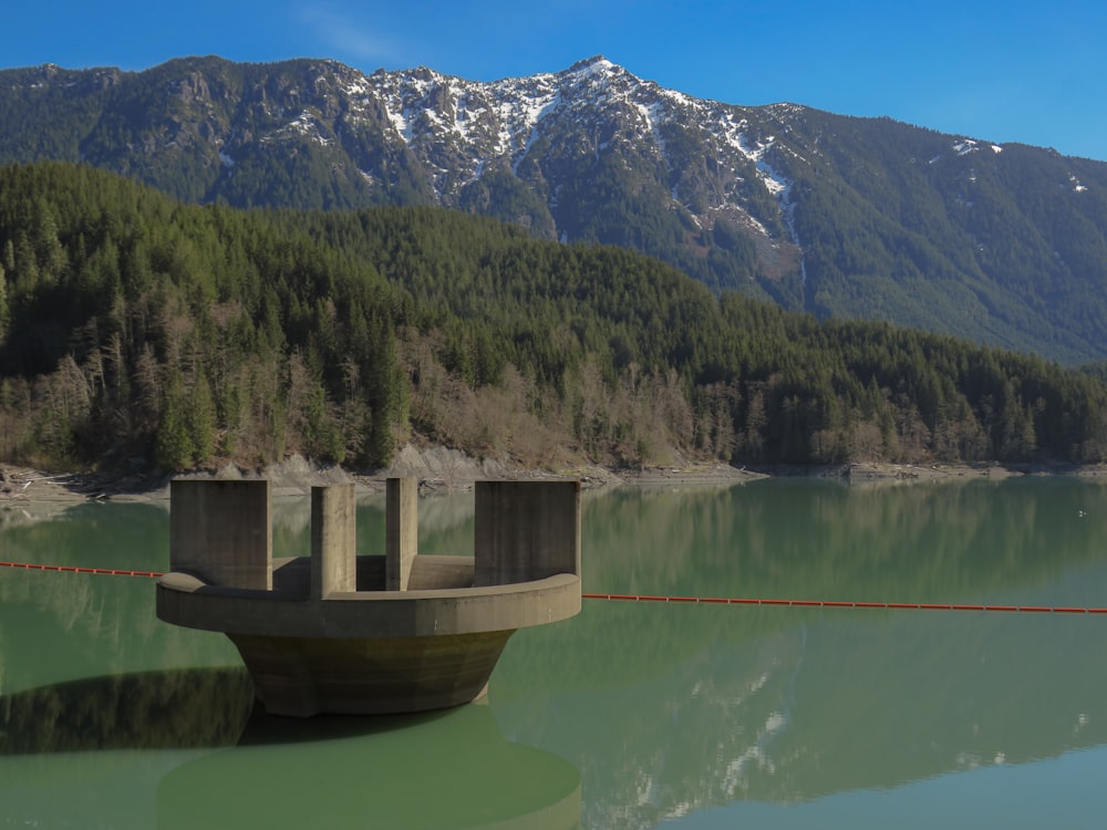 a boat sitting in the middle of a lake