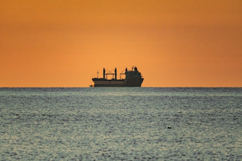 a large boat floating on top of a large body of water
