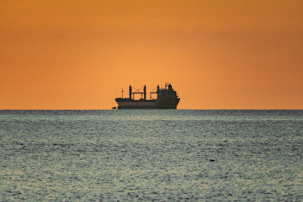 a large boat floating on top of a large body of water