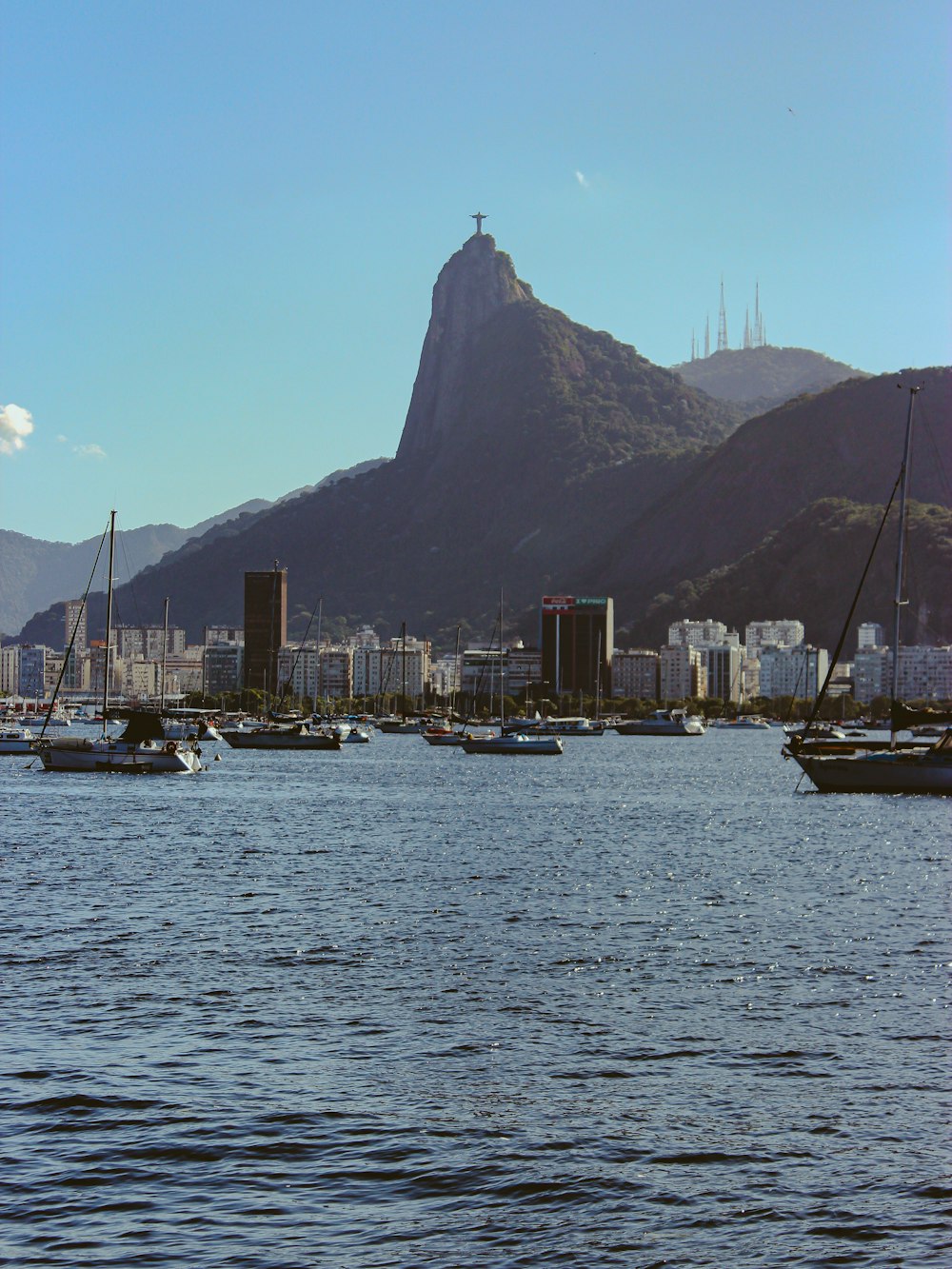 a group of boats floating on top of a body of water