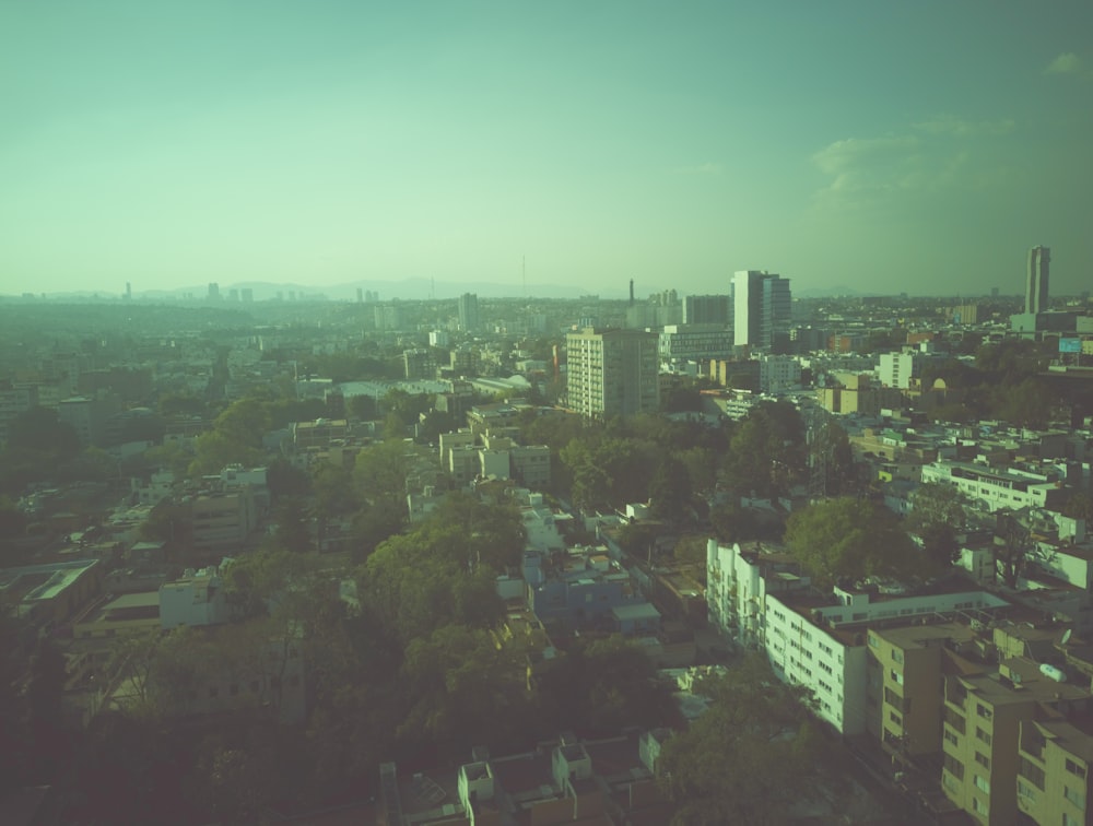 an aerial view of a city with tall buildings