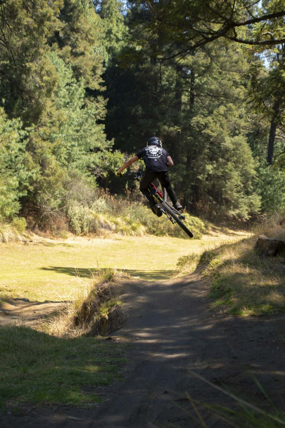 a person jumping a bike in the air