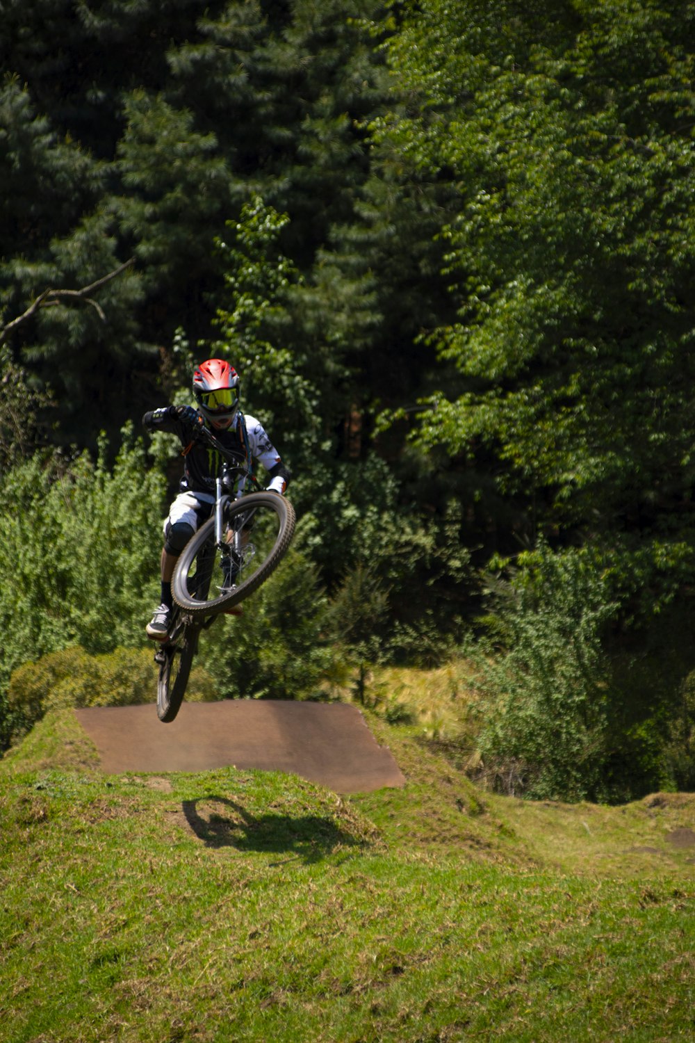 a person jumping a bike in the air