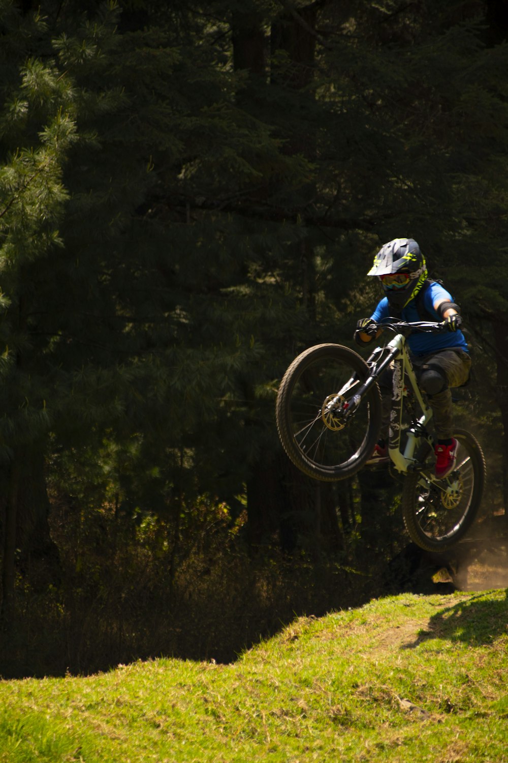 a person jumping a bike in the air