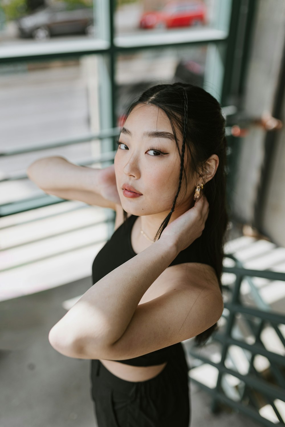 a woman in a black top posing for a picture