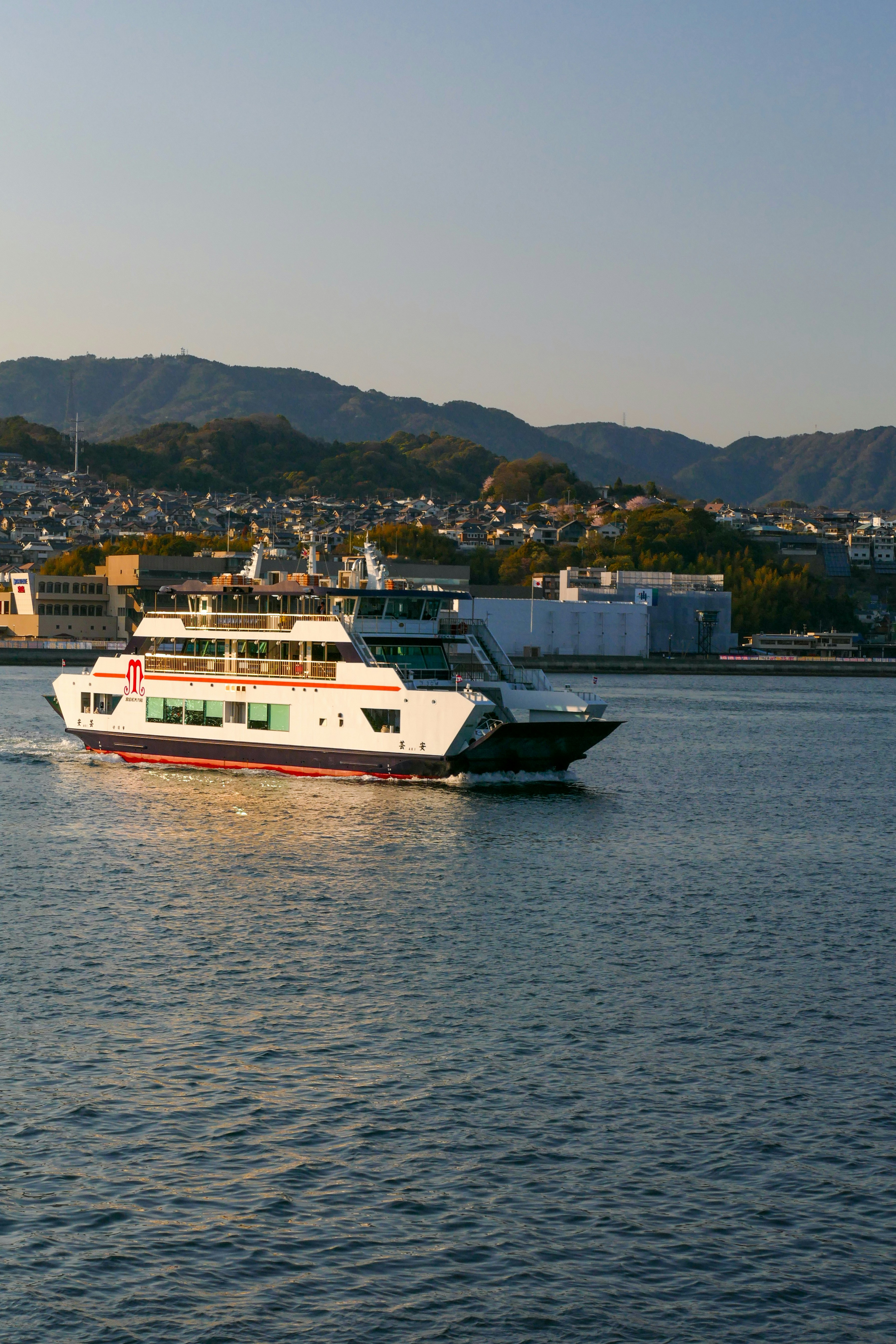 a large white boat traveling across a large body of water