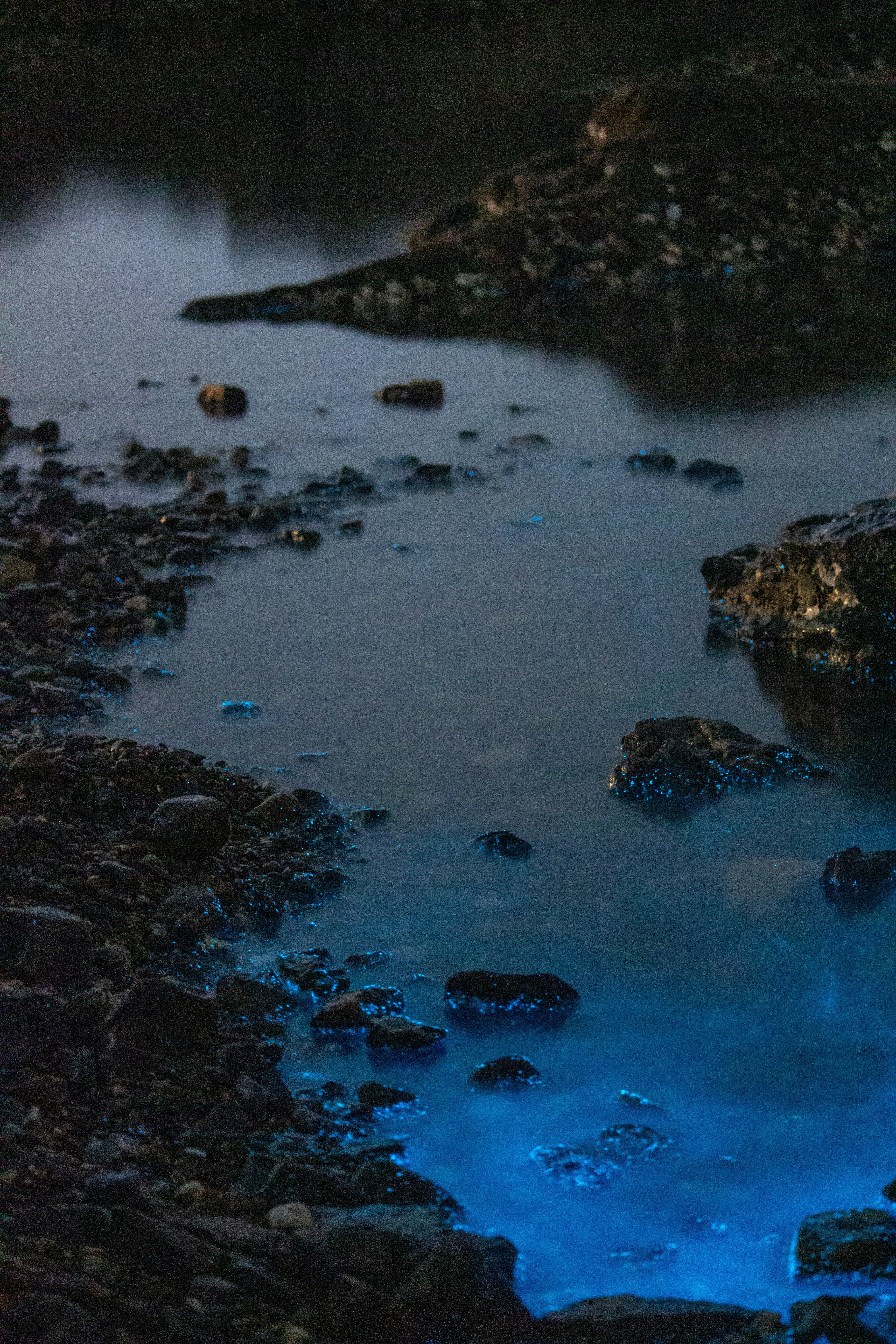 A body of water surrounded by rocks and rocks photo – Free Dalian Image ...