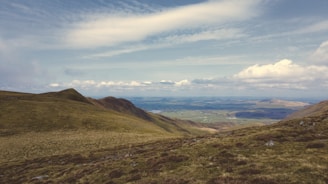 A scenic view of a sprawling Texas countryside with clear skies and open land.