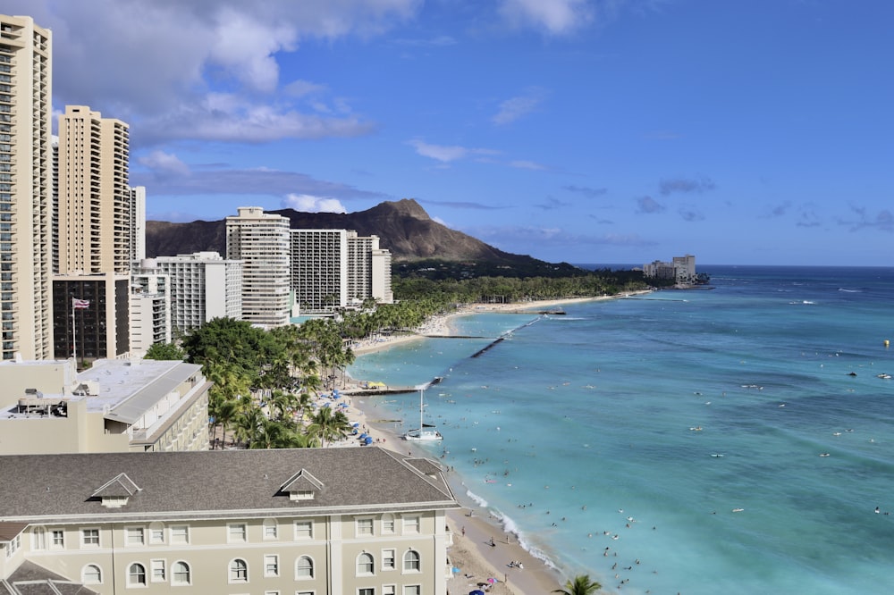 a view of a beach with buildings in the background