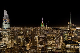 A vibrant cityscape with red and green highlights reflecting the brand colors.