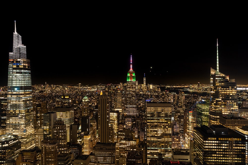 a view of a city at night from the top of a building