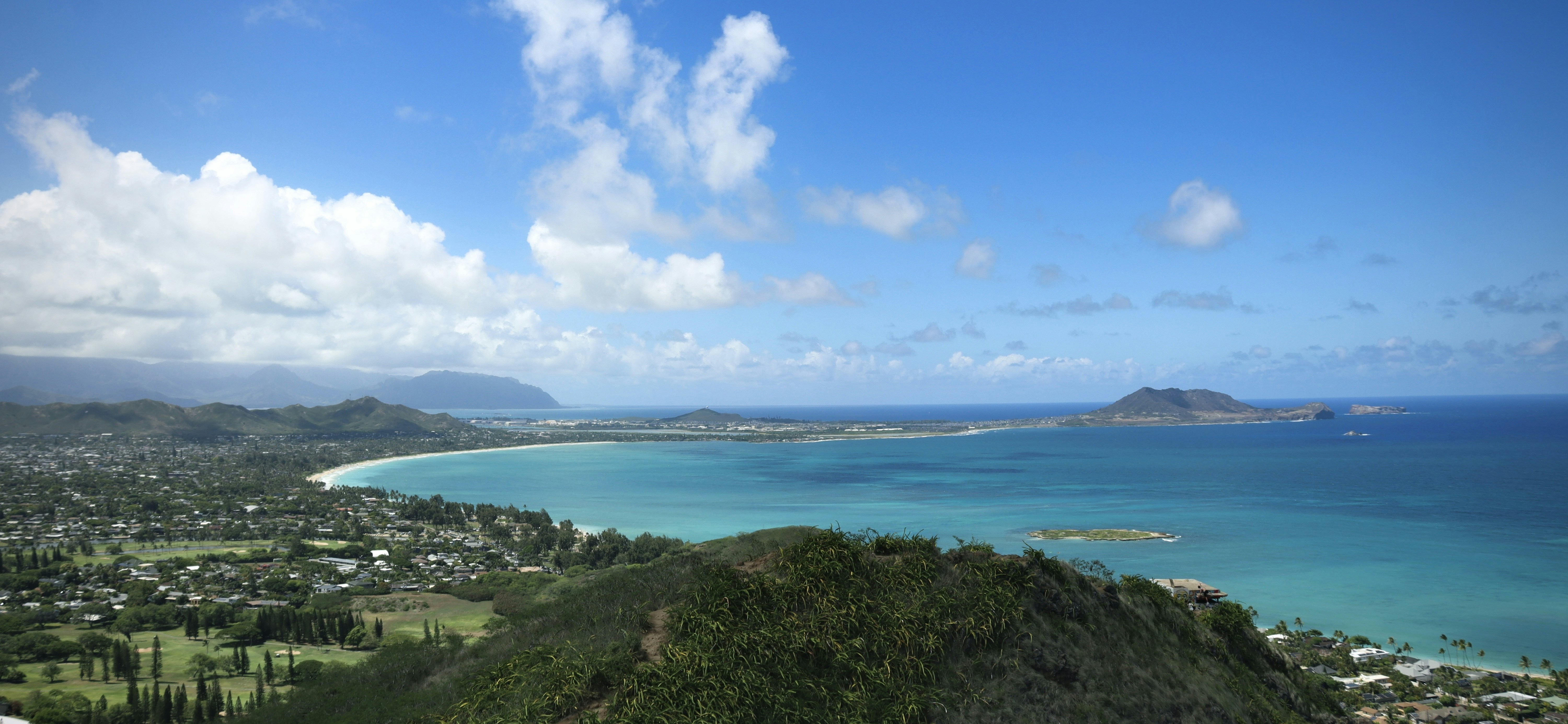 a scenic view of a tropical island and the ocean, 