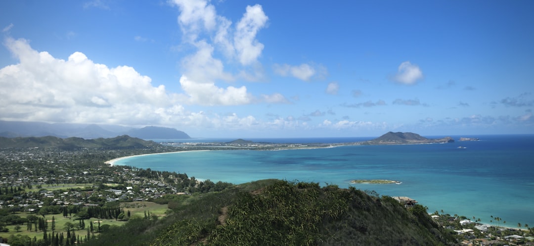a scenic view of a tropical island and the ocean,