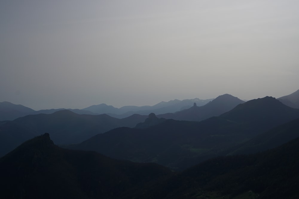 a view of a mountain range at dusk