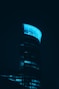 a very tall building lit up in the dark