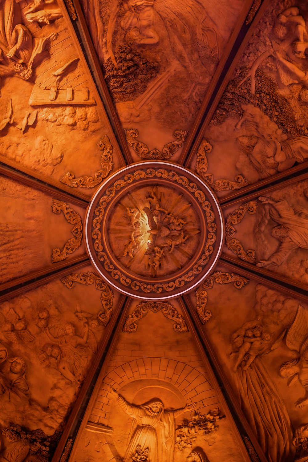 a decorative ceiling with a circular design on it