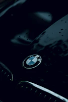 Side view of a sleek BMW with a deep glossy finish after ceramic coating treatment.