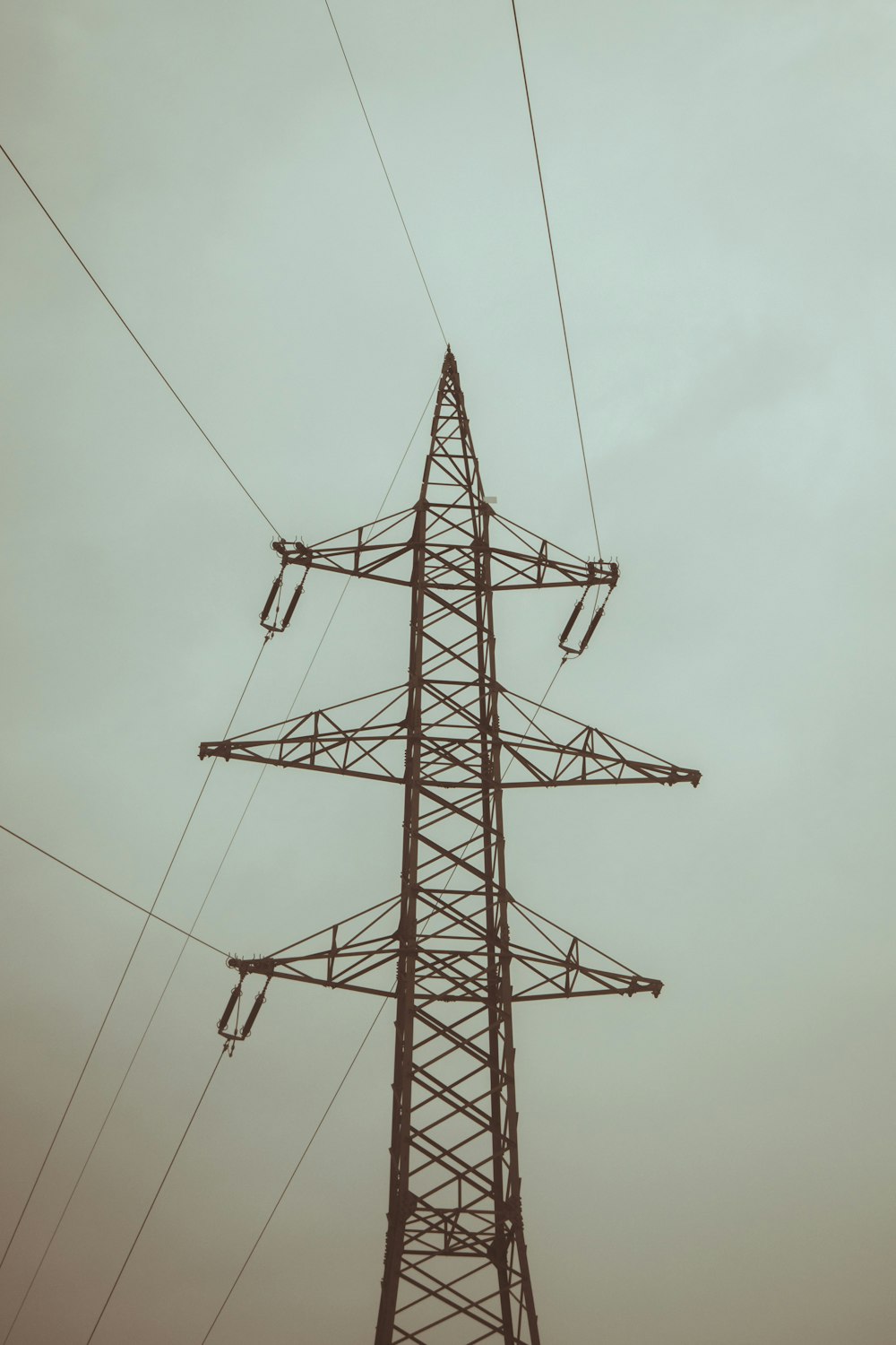 a high voltage power line with a sky background