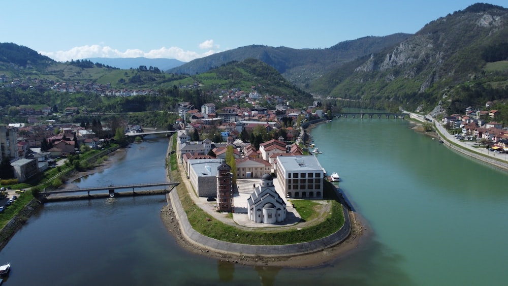 an aerial view of a small town by a river