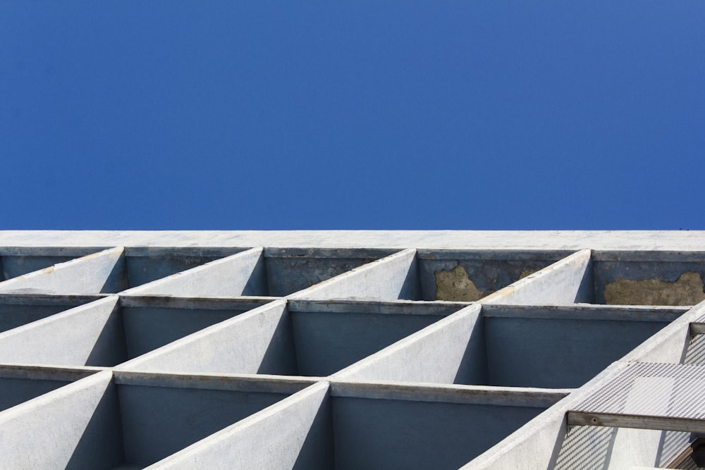 a concrete structure with a blue sky in the background