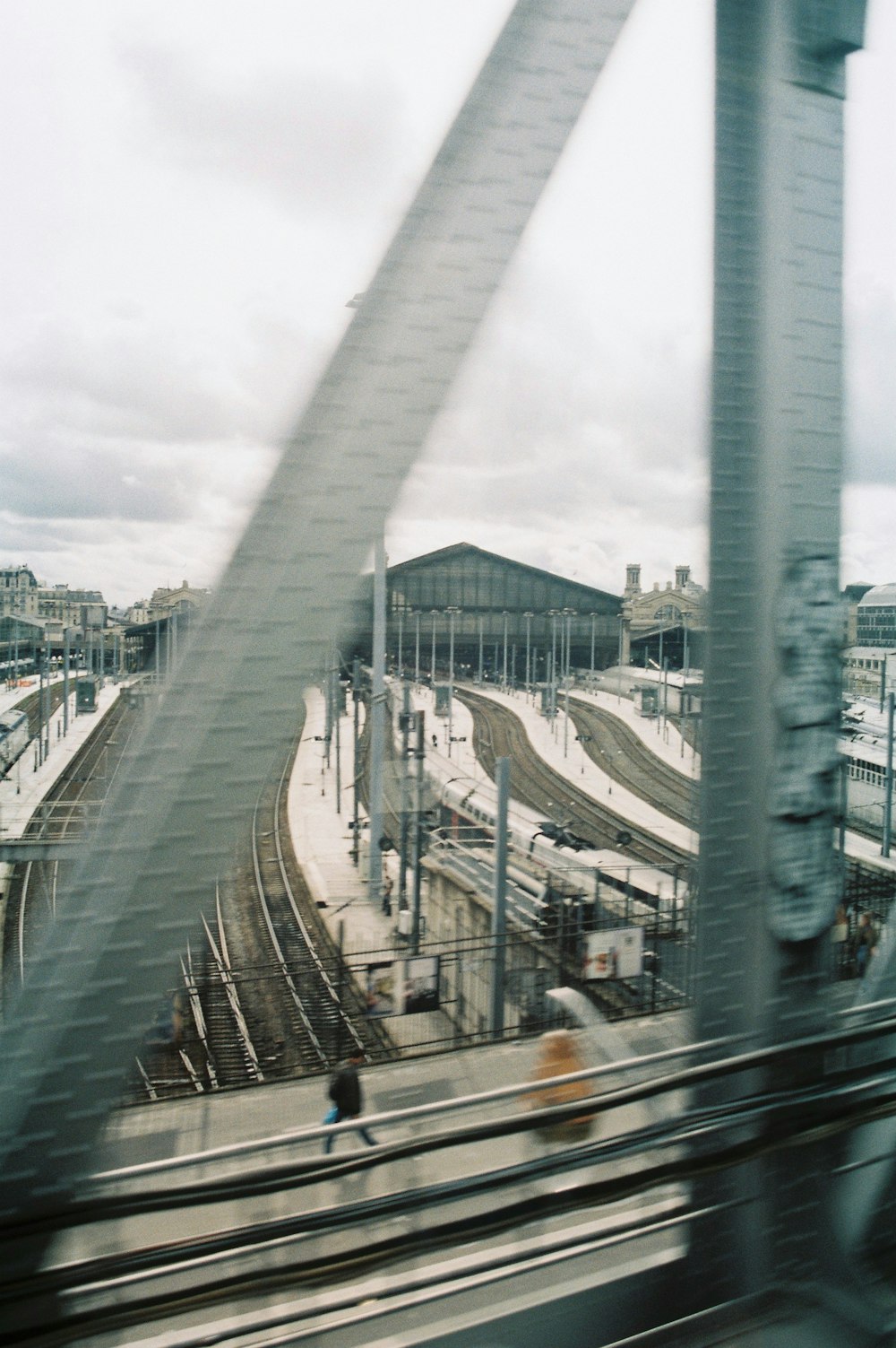 a view of a train station from a moving train