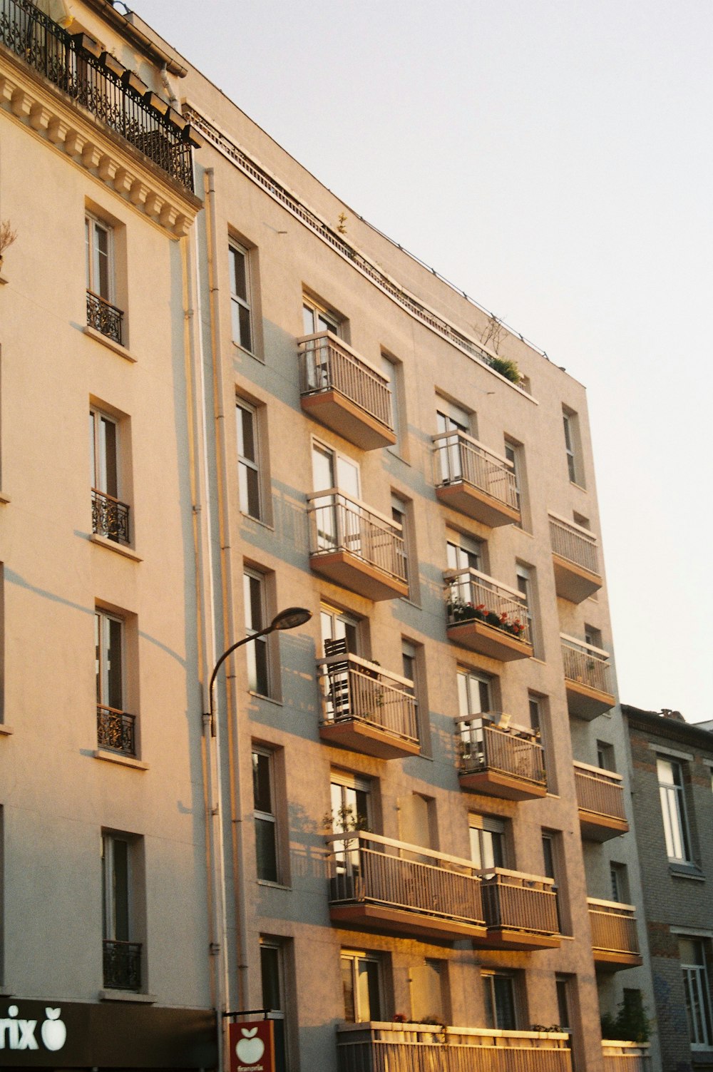 a tall building with balconies and balconies on the balconies