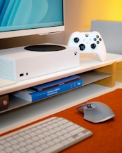 a video game console sitting on top of a desk