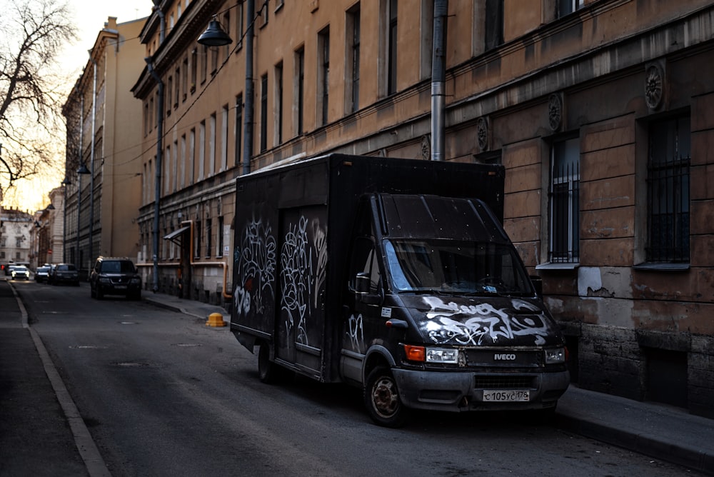 a delivery truck parked on the side of a street