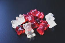 a pile of gummy bears sitting on top of a table