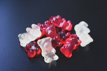 a pile of gummy bears sitting on top of a table