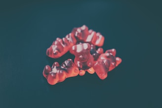 a group of gummy bears sitting on top of a table