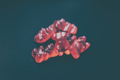 a group of gummy bears sitting on top of a table