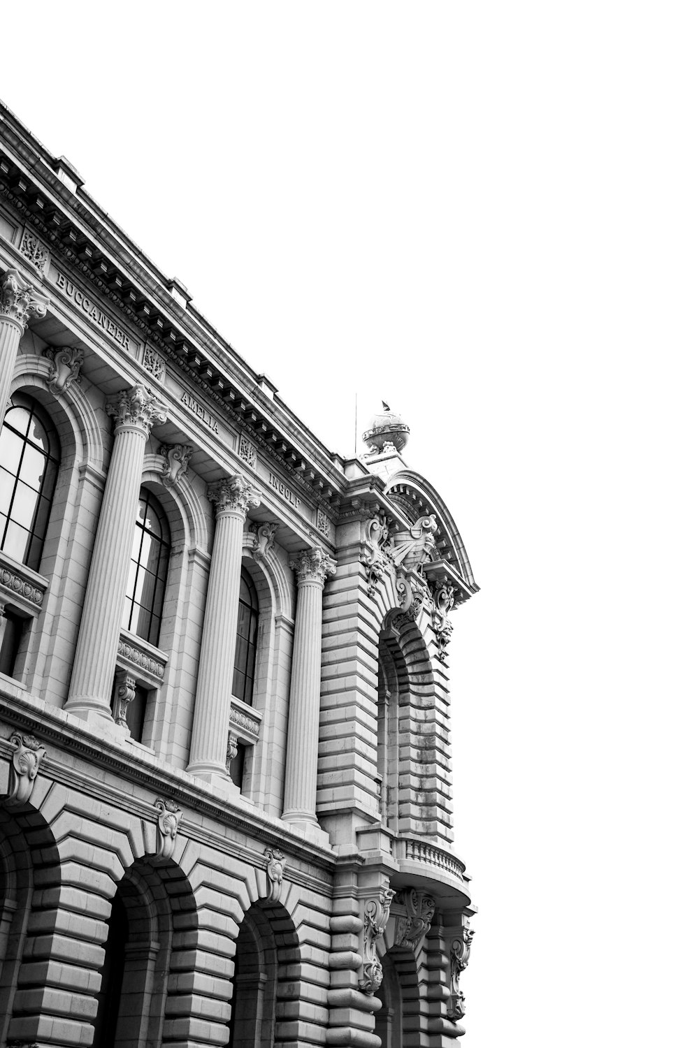 a black and white photo of a large building