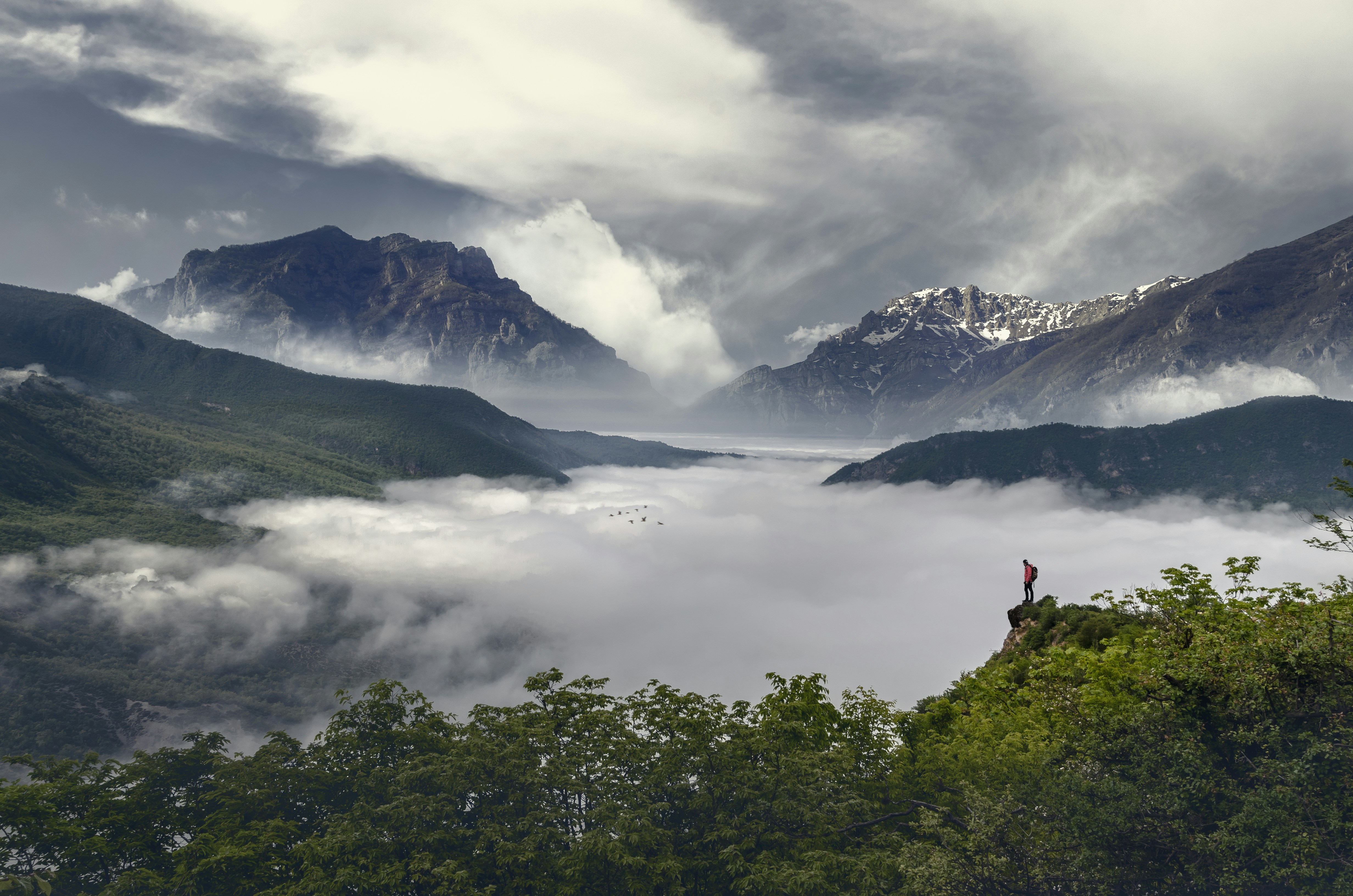 a person standing on top of a mountain