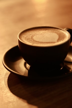 Softly lit scene of a quiet morning coffee shared between two family members.