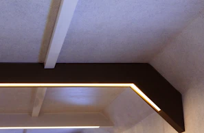 Completed elegant ceiling with integrated lighting in a commercial space
