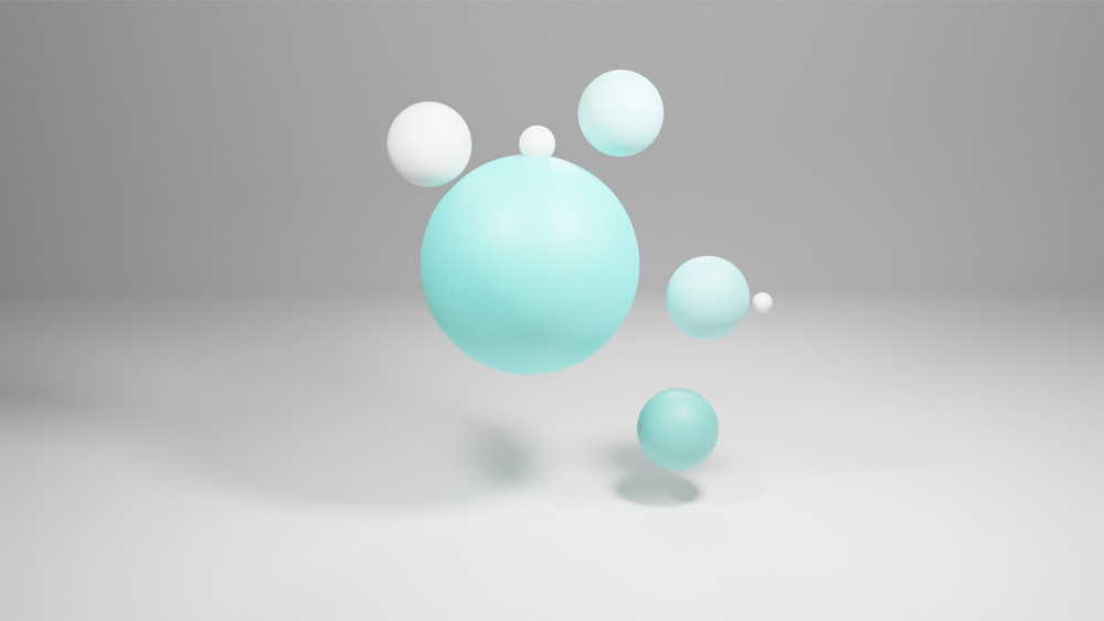 a group of blue and white balls floating in the air