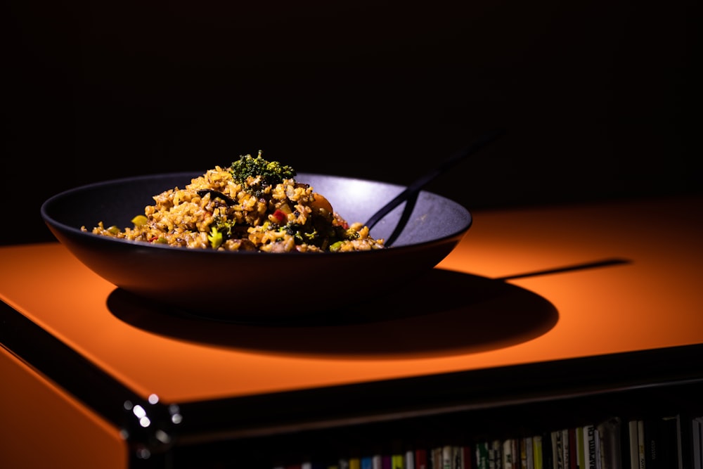 a bowl of food is sitting on a table