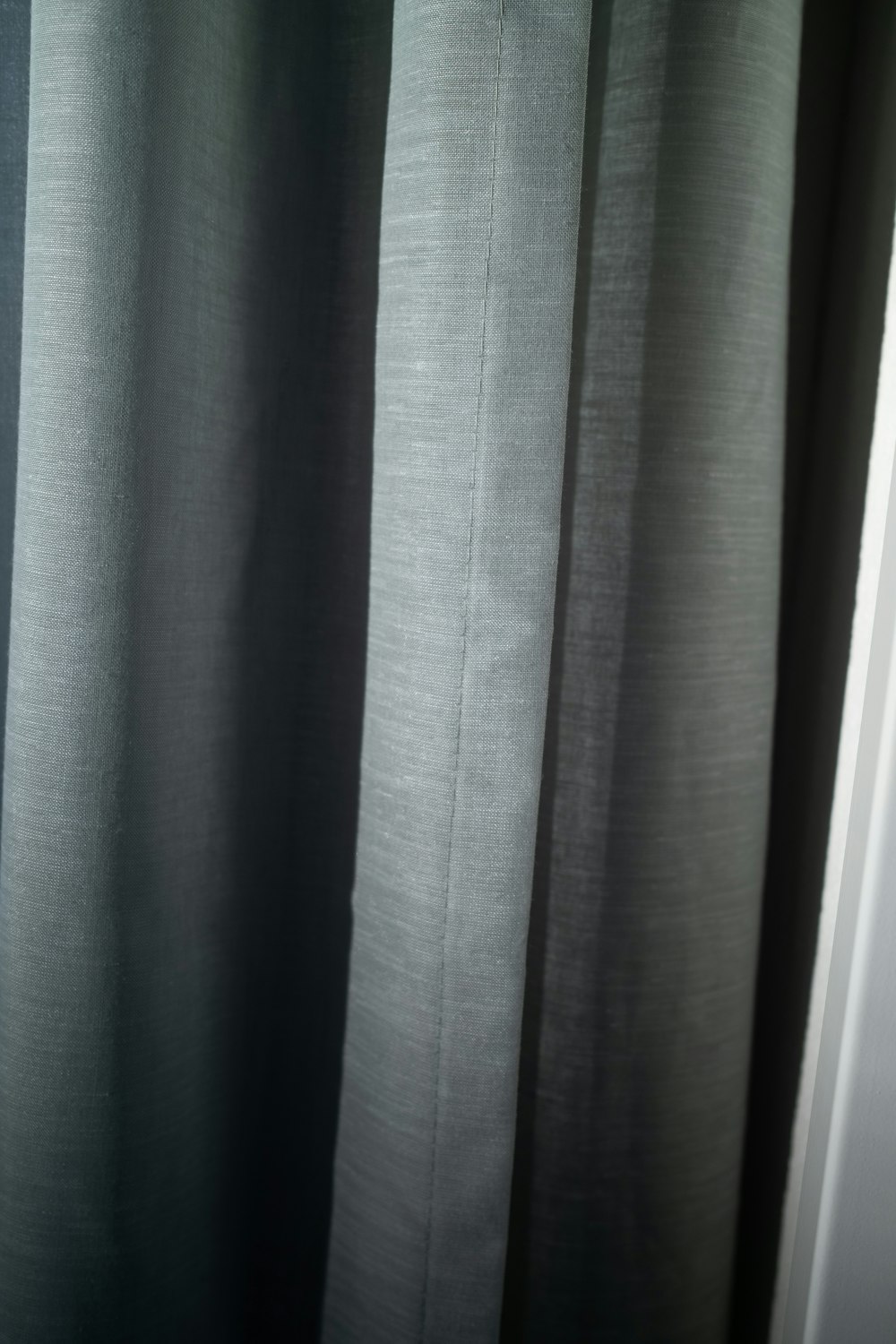 a black and white photo of a curtain