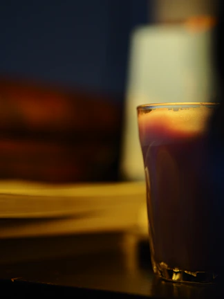 Close-up of a personalized glass with a heartfelt message in a cozy home setting