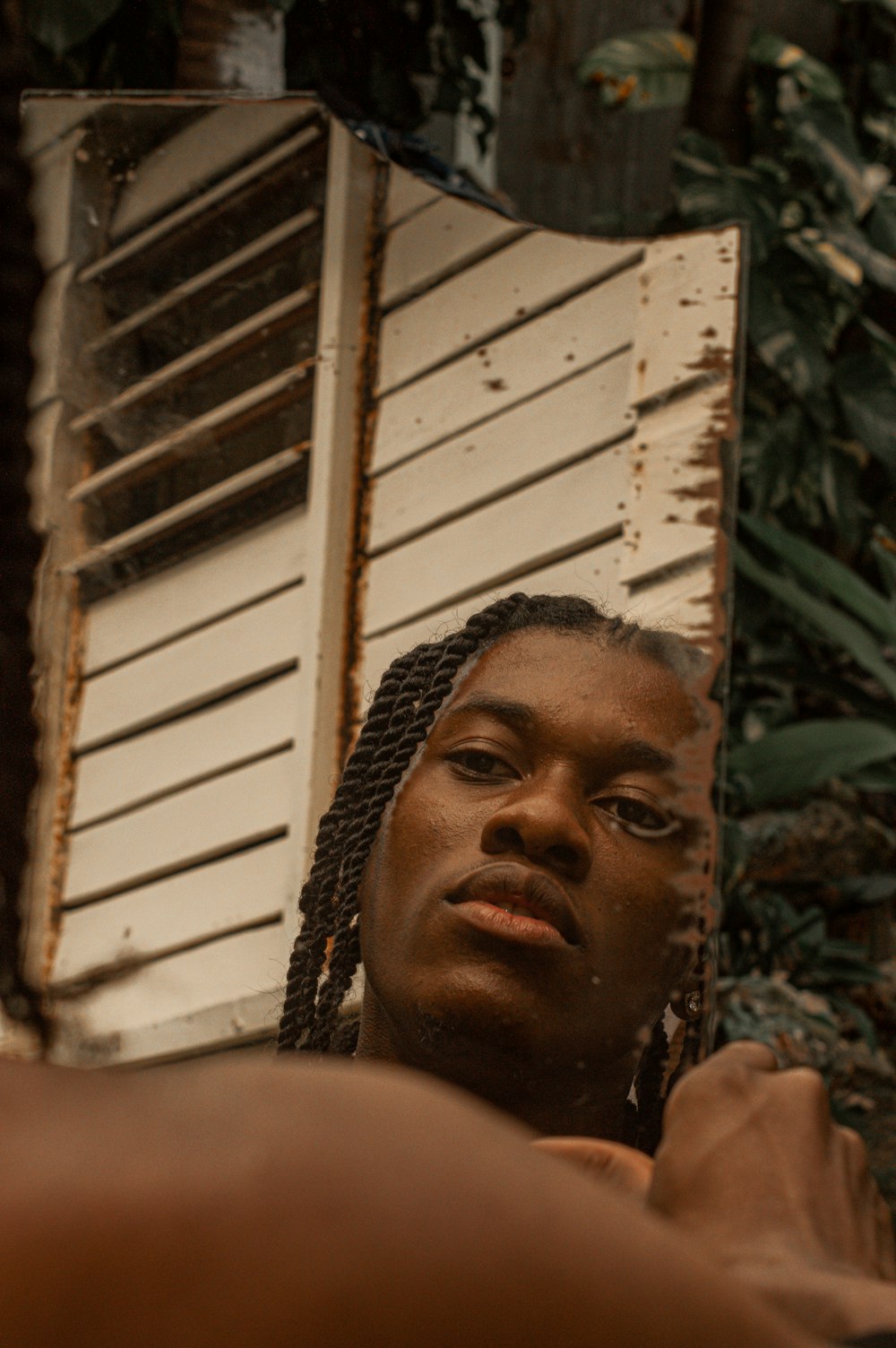 a woman looking at her reflection in a mirror