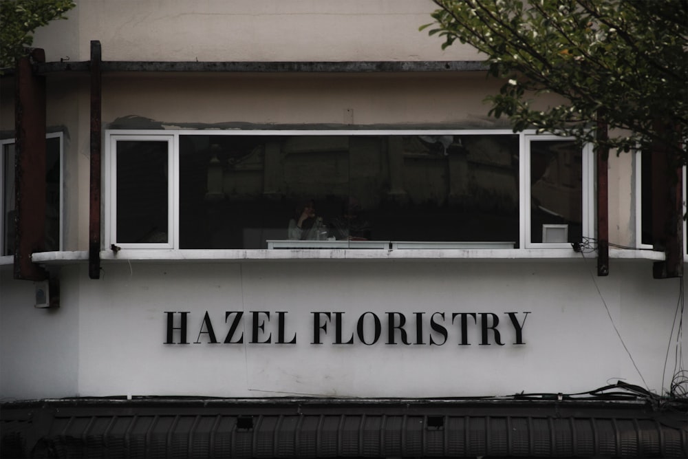 a building with a sign that says hazel floristy