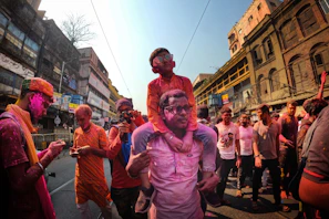 Colorful Holi festival celebration with people throwing vibrant powders