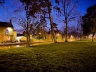 A serene evening scene of the yeshiva building glowing softly under the stars.