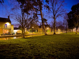 A serene evening scene of the yeshiva building glowing softly under the stars.